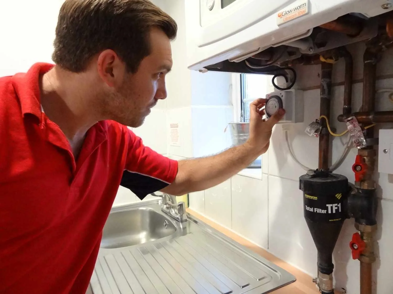 Shepperton Plumbers boiler repair engineer working on a boiler in Shepperton